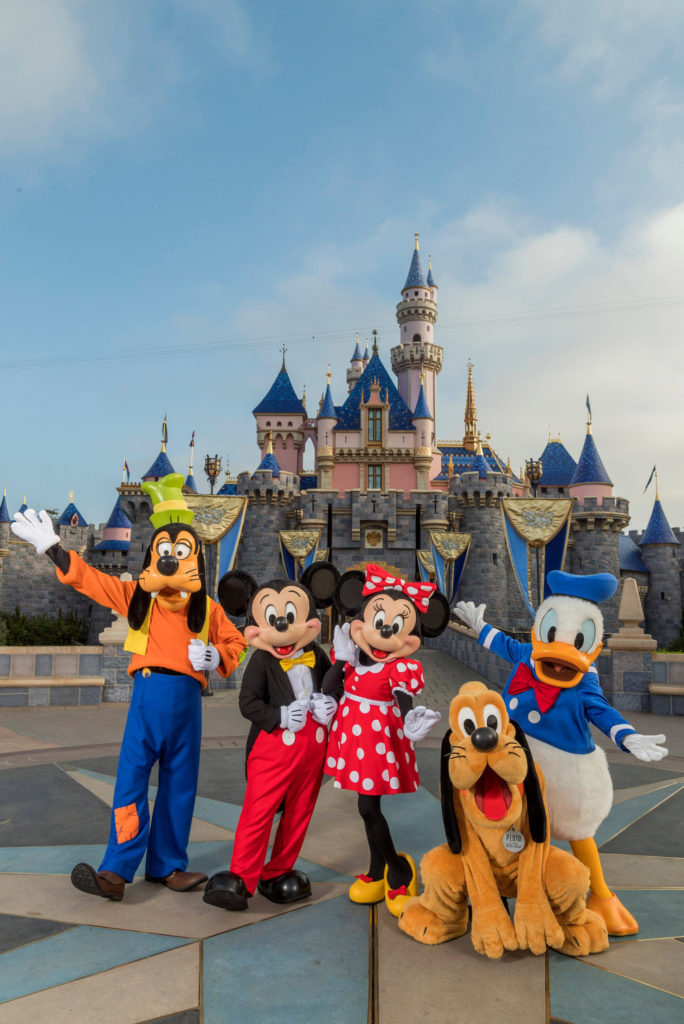 Disney characters in front of the Castle in Disneyland